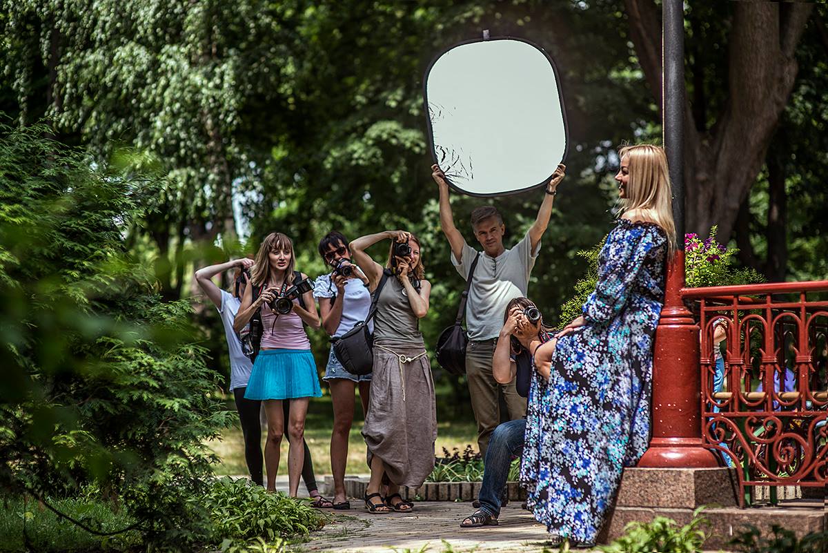 taking pictures in the open air on a bright sunny day. Only a reflector or flash can help you take a nice shot